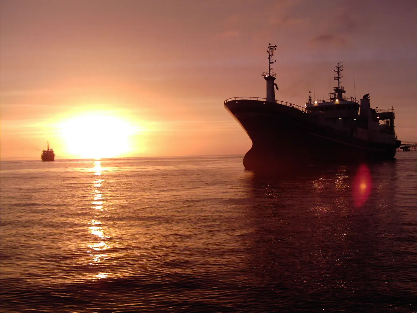 FoodCorp fishing vessel at sunset — an efficiently equipped fleet delivering pelagic raw material from the South Pacific.
